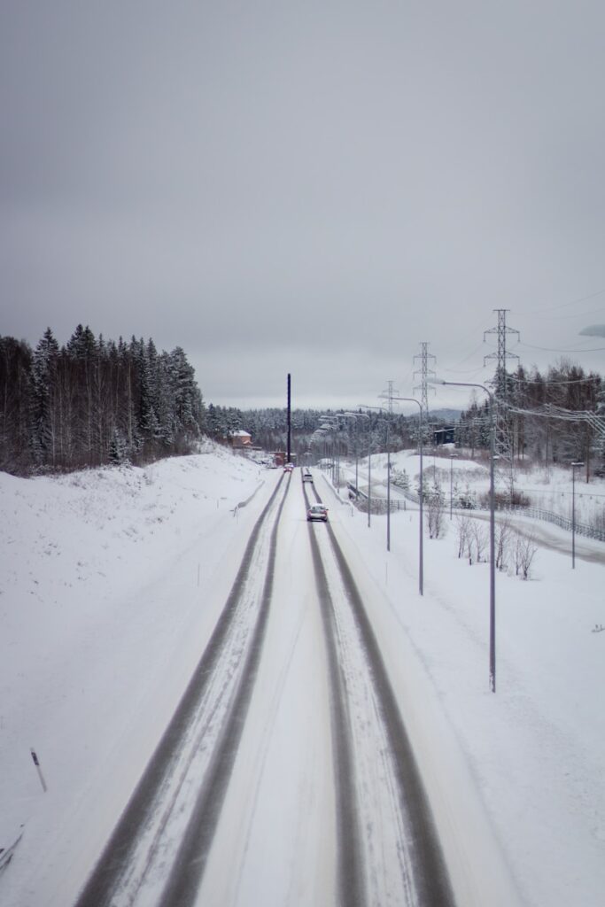 snow covered road during daytime