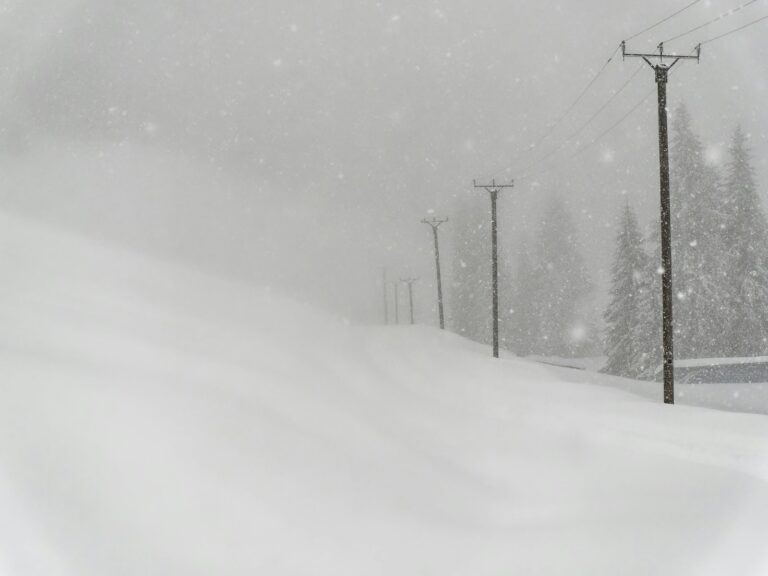 a person riding skis down a snow covered slope